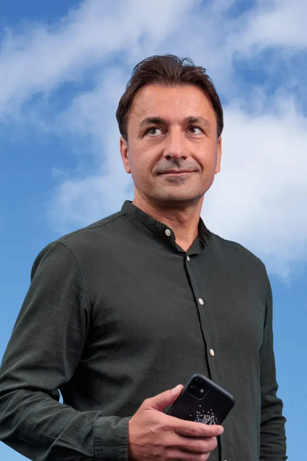 Man captured in a close-up portrait outdoors